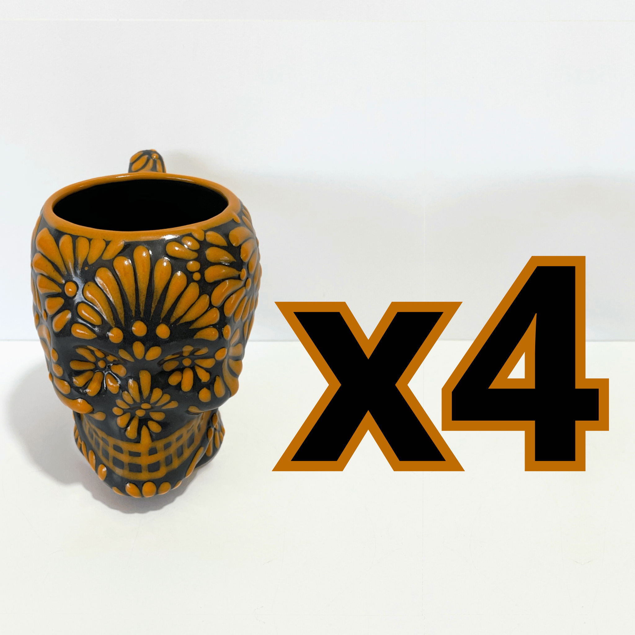 TAZA FORMA DE CRANEO FONDO NEGRO MIK NARANJA