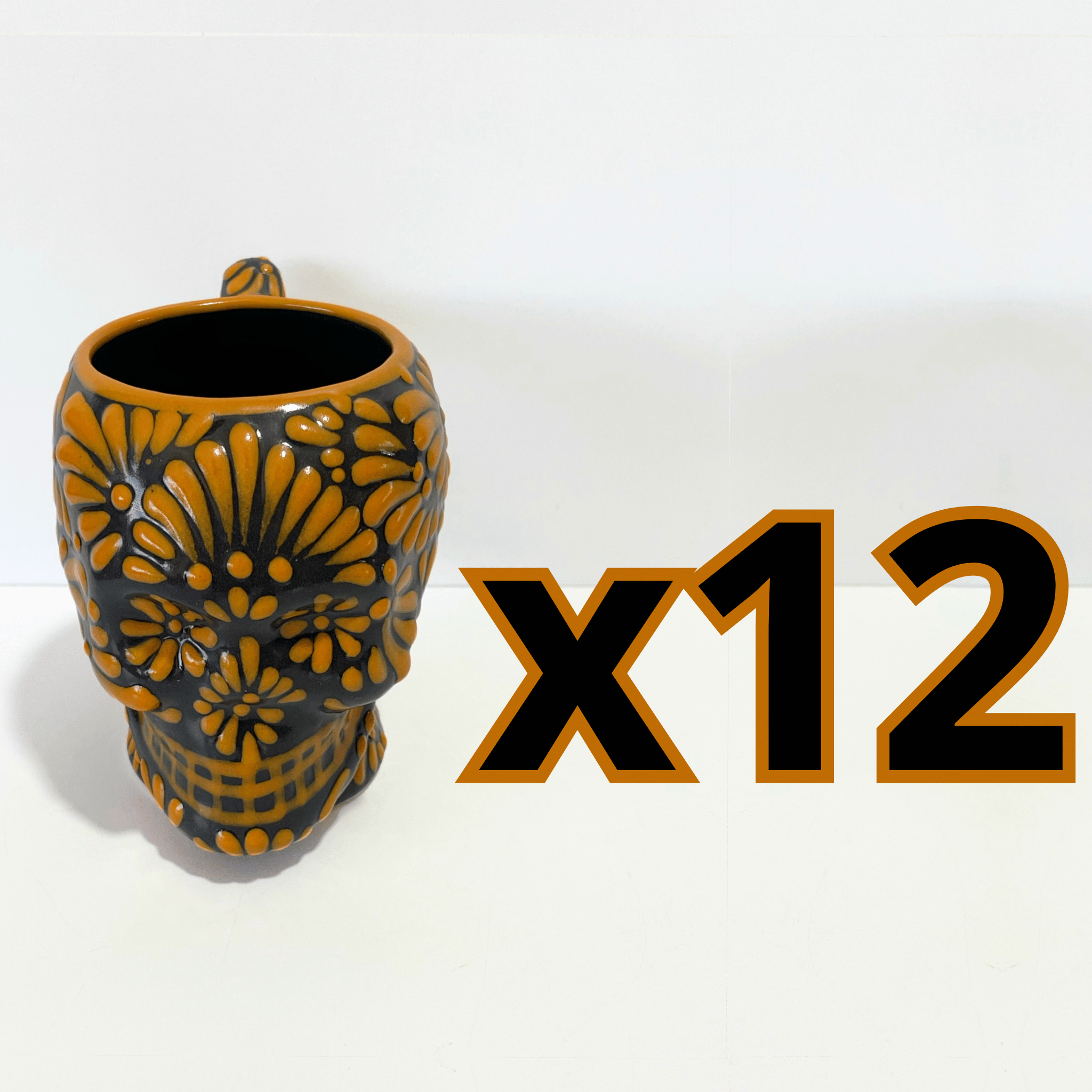 TAZA FORMA DE CRANEO FONDO NEGRO MIK NARANJA