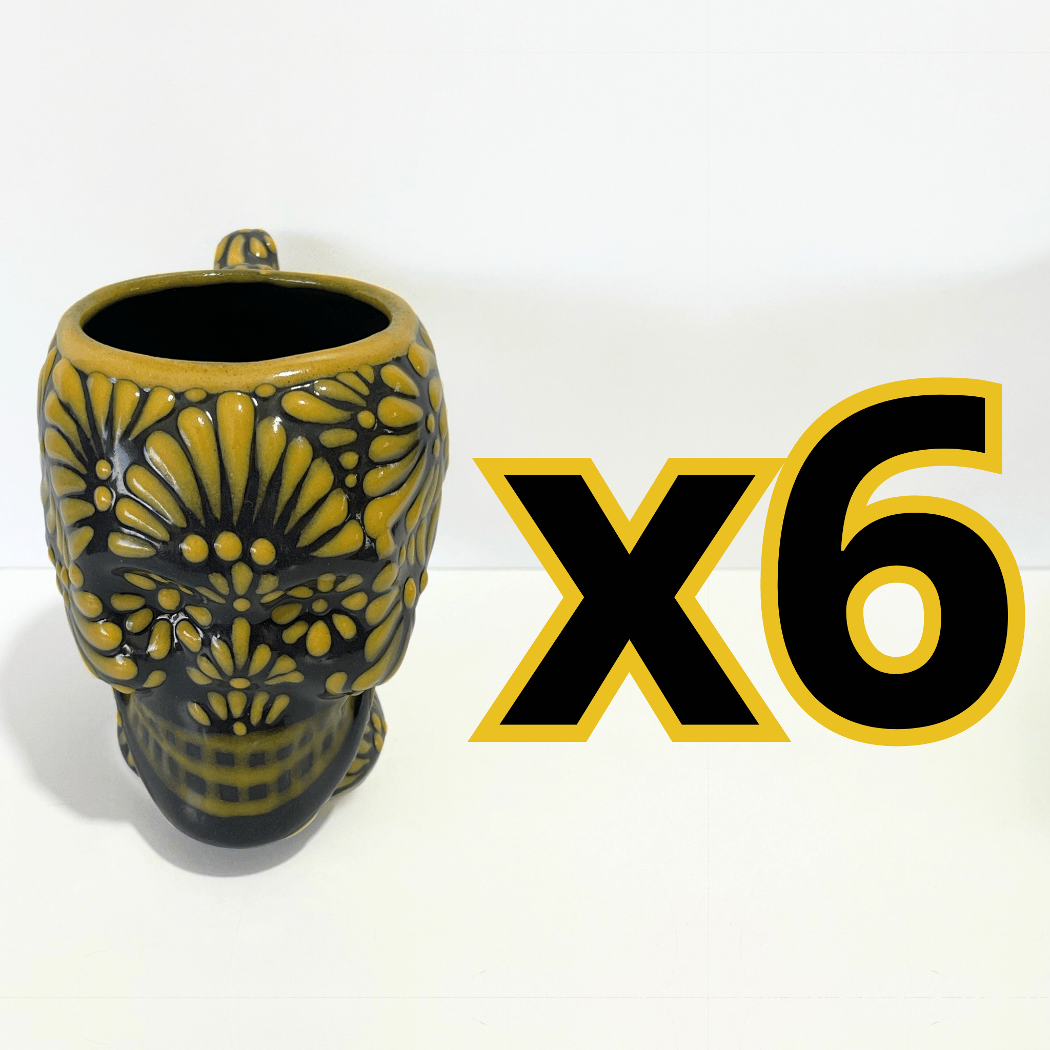 TAZA FORMA DE CRANEO FONDO NEGRO MIK AMARILLO