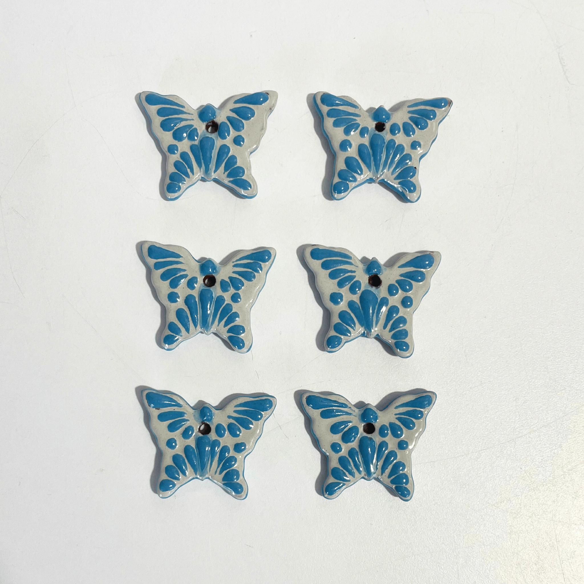 MARIPOSA 4.2 CM FONDO TRADICIONAL DECORADO AZUL TURQUESA