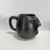 TAZA CARITA BARRO NEGRO